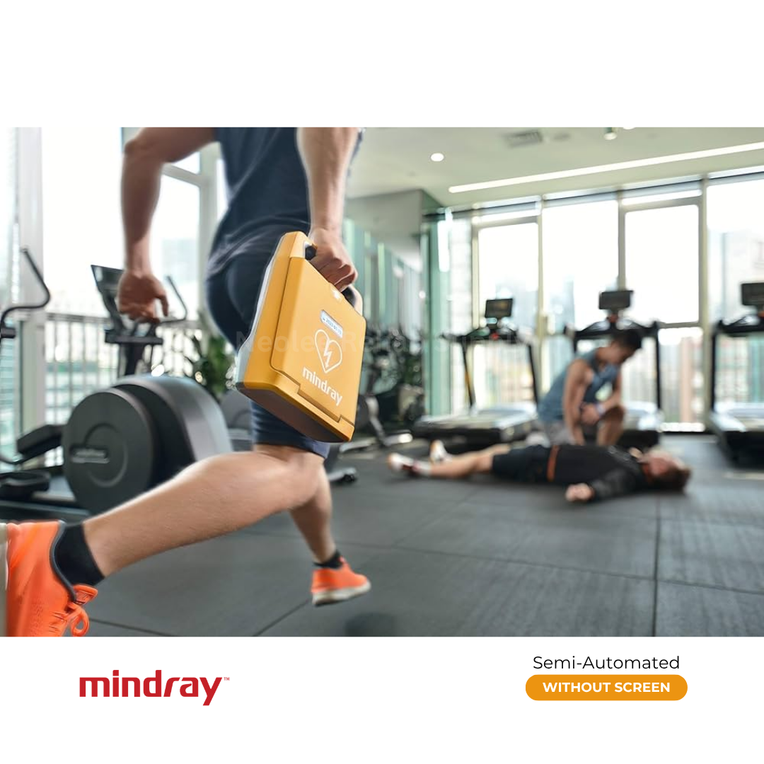 Man bringing a Mindray BeneHeart C1A semi-automatic AED for emergency defibrillation at a gym