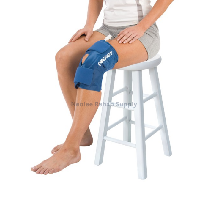 Woman wearing Aircast knee cryo cuff for knee rehabilitation, sports injury recovery, and inflammation reduction therapy.