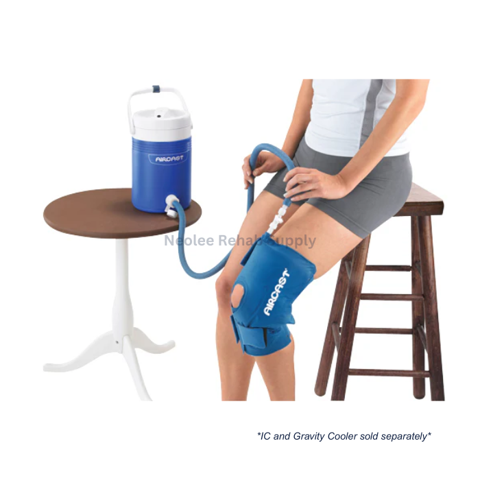 User receiving knee cold therapy treatment using Aircast knee cryo cuff connected to portable cooling unit for rehabilitation support.