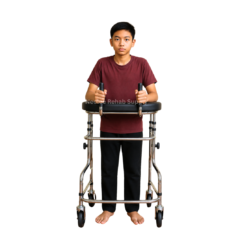 Front view of a user standing with a forearm rollator walker featuring adjustable forearm supports, ergonomic hand grips, and stable wheeled frame for gait training and posture support.